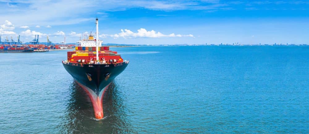 Container ship carrying container in import and export global business commercial logistic and freight shipping transportation by container ship, Container loading cargo ship vessel with copy space.